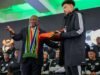 Kekacauan visa menunda keberangkatan Bafana Bafana karena McKenzie menuntut jawaban
