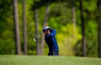 McIlroy masih mengejar saat Rahm mulai kuat pada hari Minggu