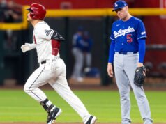Dodgers menangkis upaya kembalinya Diamondbacks dengan peringatan dari Nolan Arenado