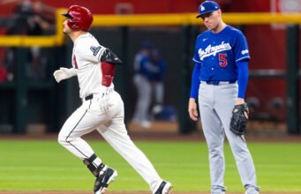Dodgers menangkis upaya kembalinya Diamondbacks dengan peringatan dari Nolan Arenado